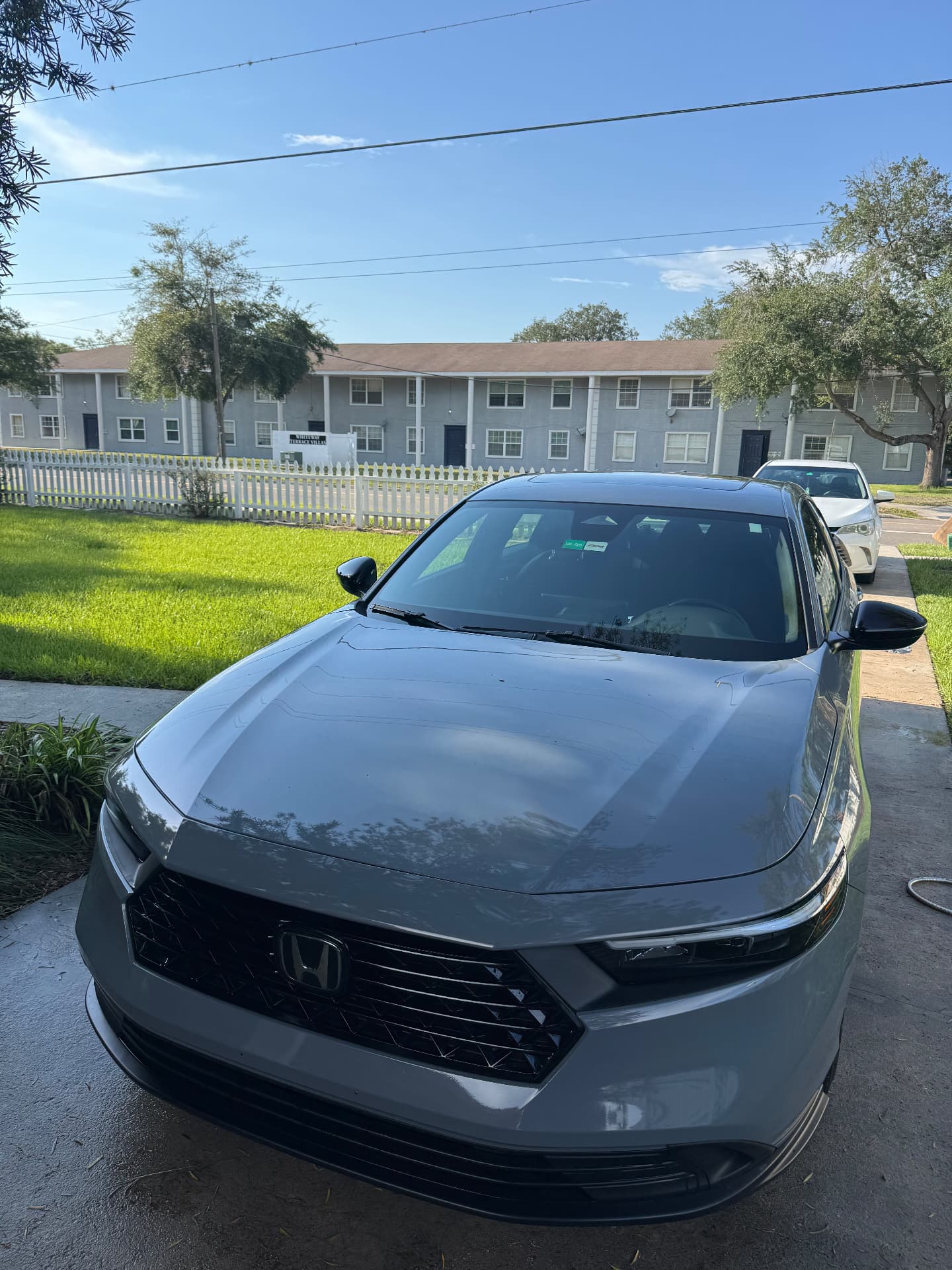 Gray Honda Accord with glossy finish after exterior detail