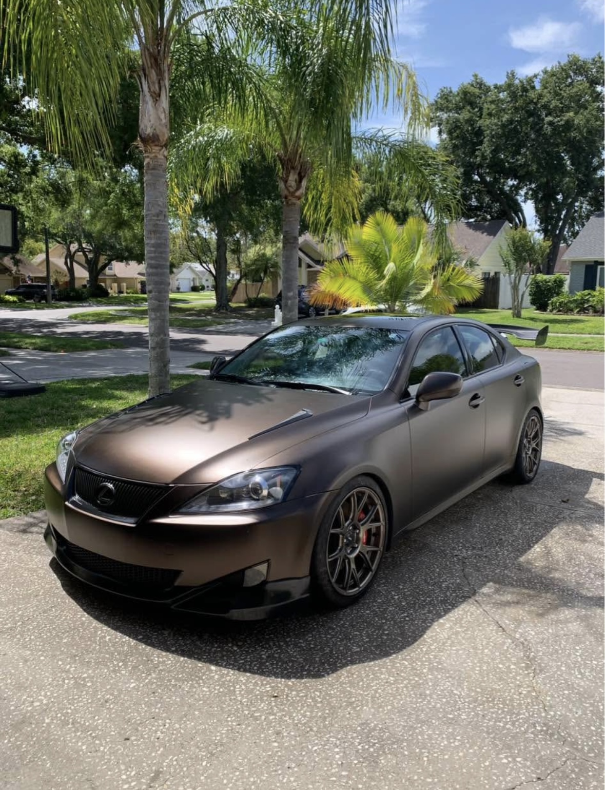 Bronze matte Lexus IS detailed in driveway